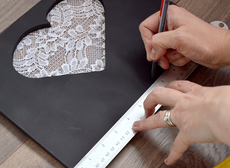 DIY Jewelry Organizer tutorial - mark spots for cup hooks