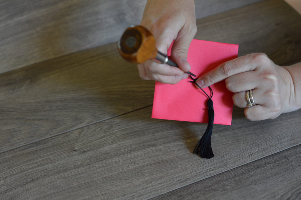 poke tassel thread through